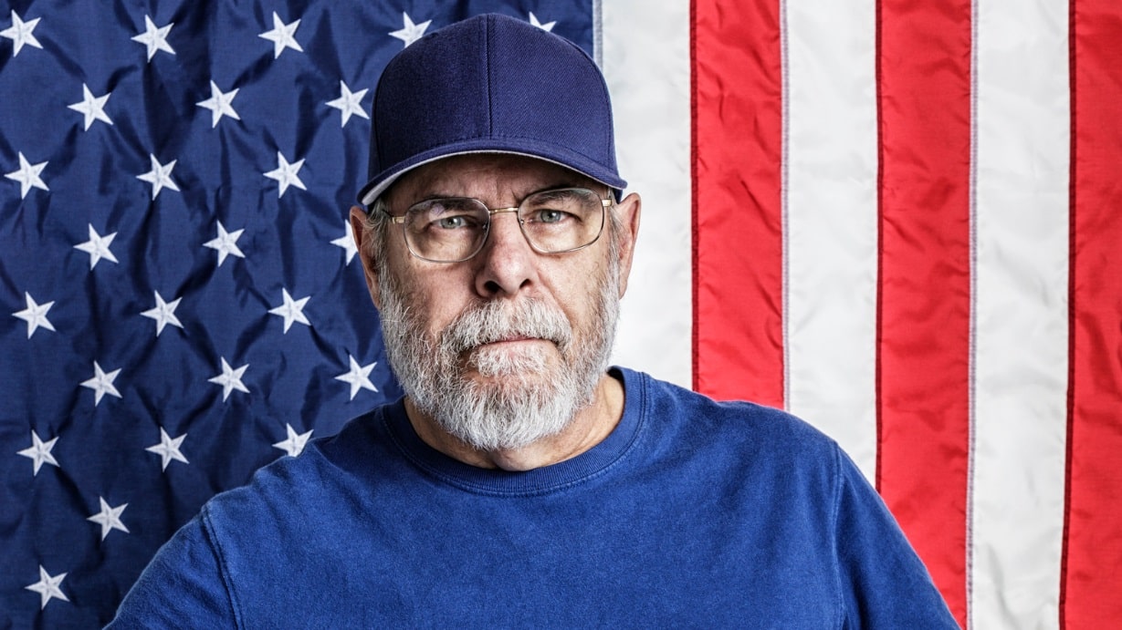 veteran in front of American flag background